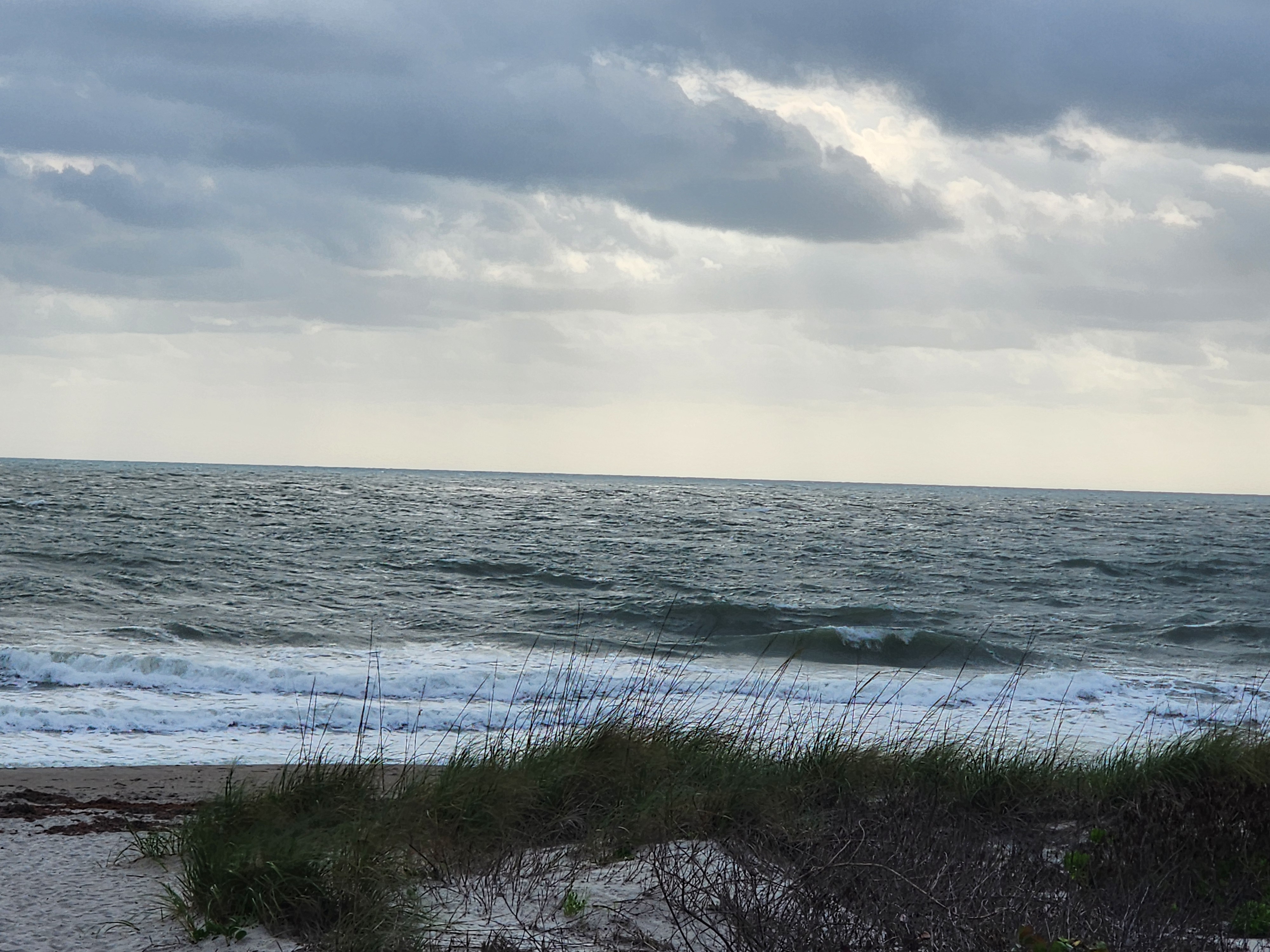 Cocoa Beach surf photo 2 — 1-2' with ENE wind swell. High tide incoming, fast drift conditions.