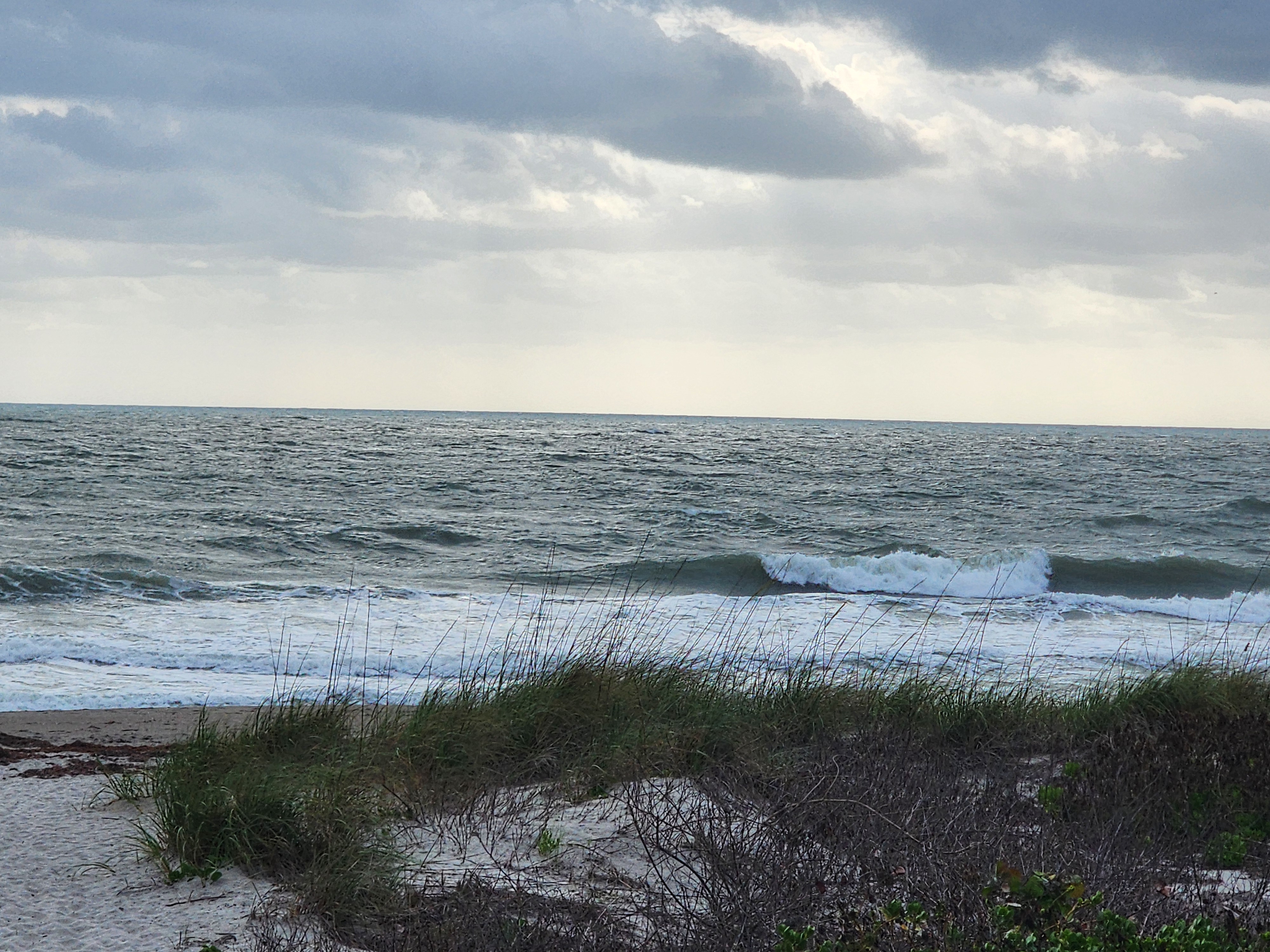 Cocoa Beach surf photo 3 — 1-2' with ENE wind swell. High tide incoming, fast drift conditions.