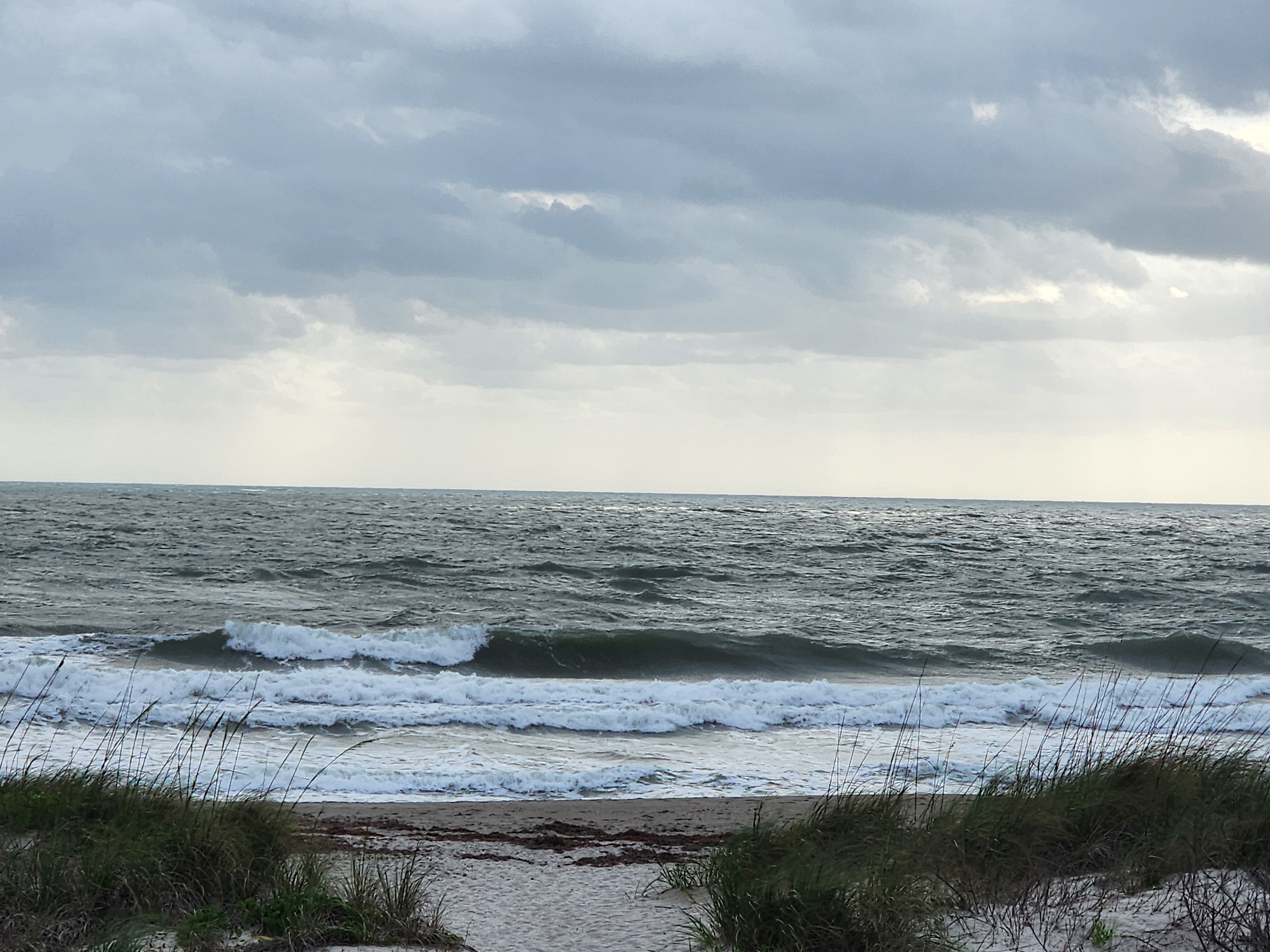 Cocoa Beach surf photo 4 — 1-2' with ENE wind swell. High tide incoming, fast drift conditions.