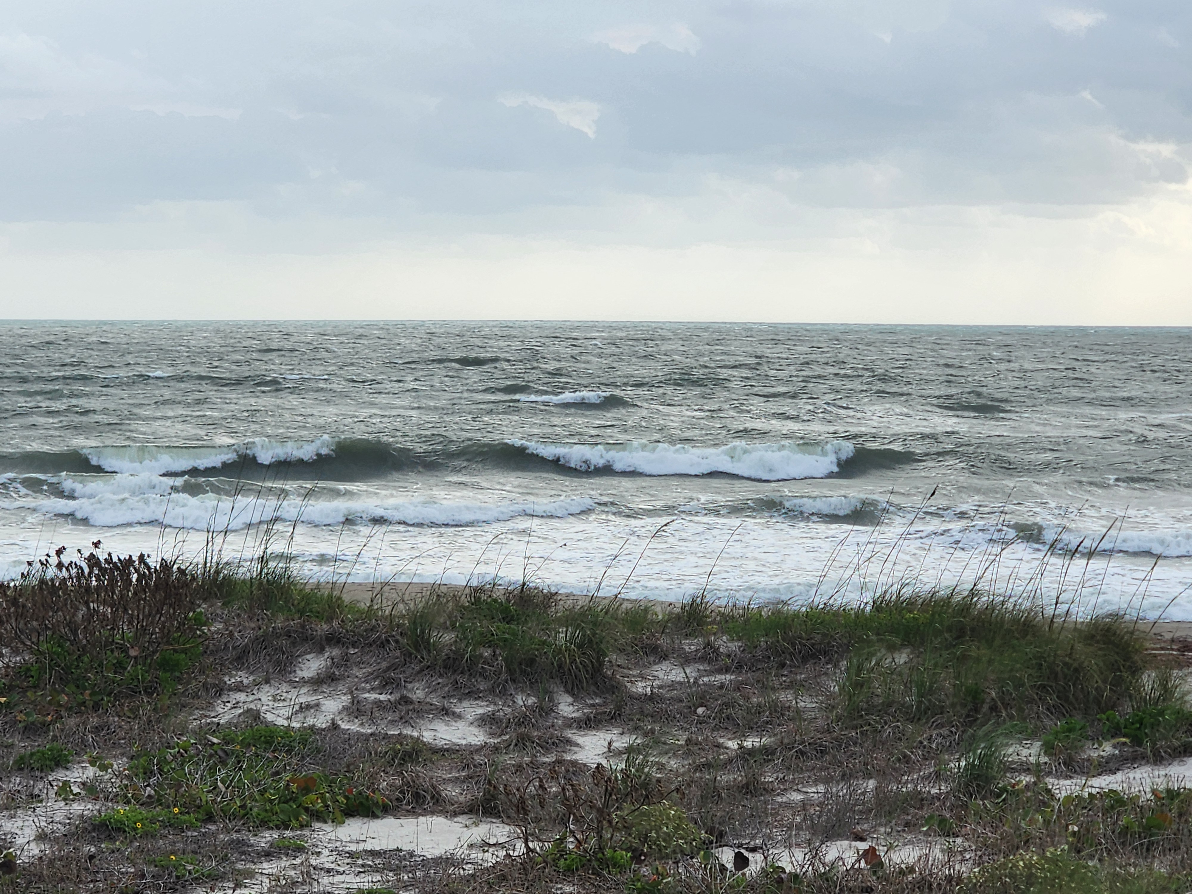 Cocoa Beach surf photo 5 — 1-2' with ENE wind swell. High tide incoming, fast drift conditions.