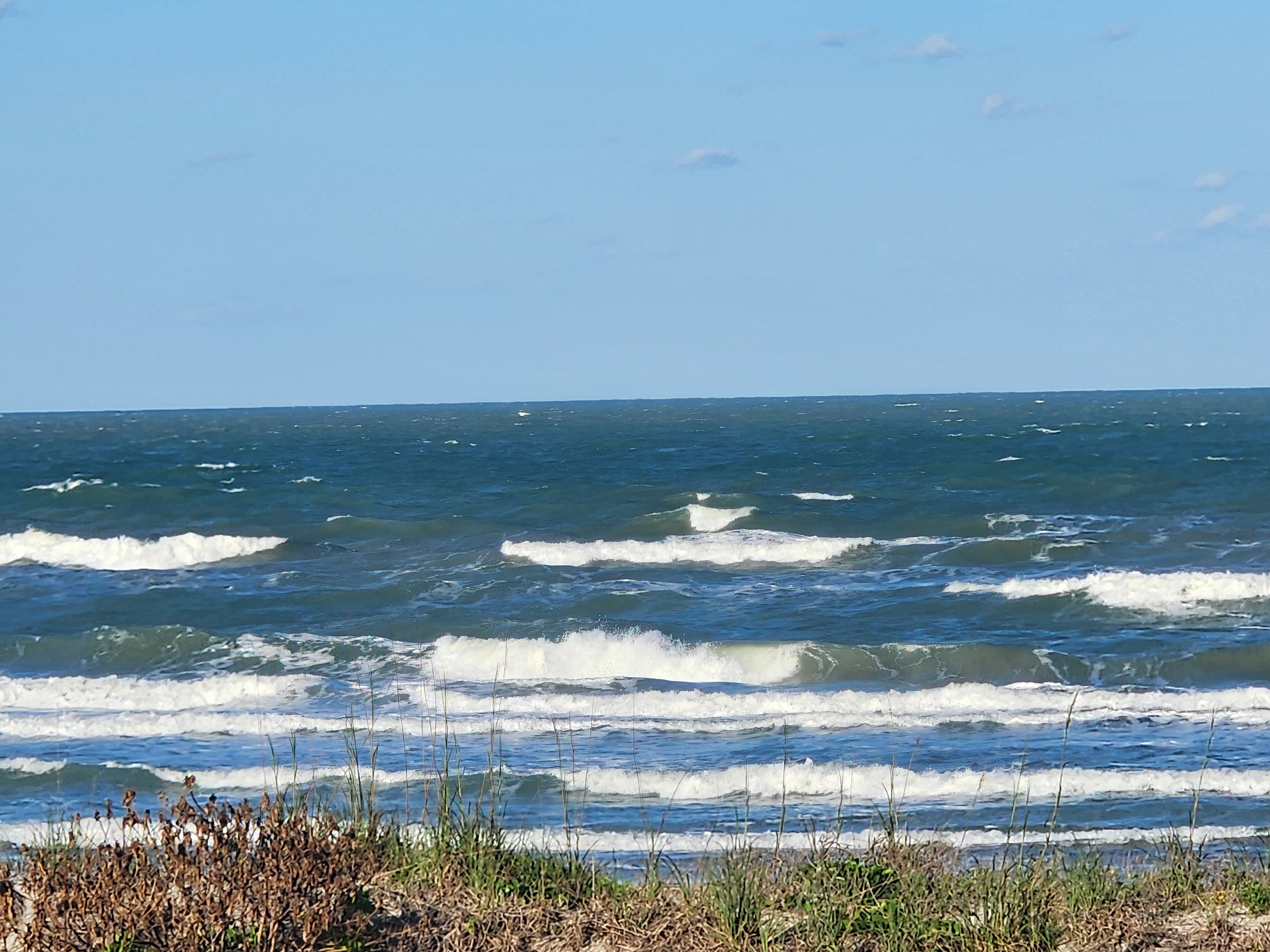 Cocoa Beach surf photo 2 — Afternoon update — 1-2' with SSE winds. Bumpy but rideable.