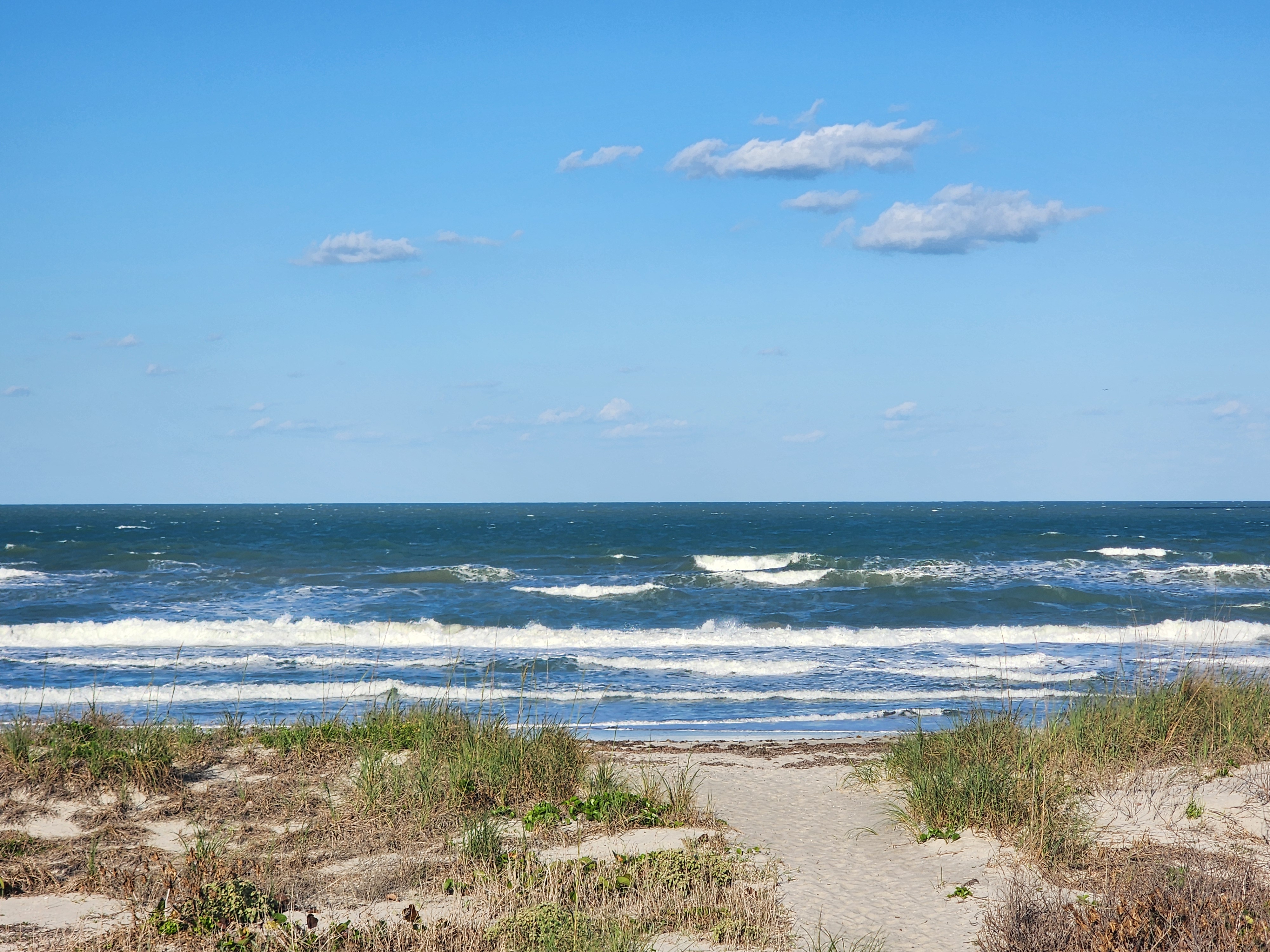 Cocoa Beach surf photo 4 — Afternoon update — 1-2' with SSE winds. Bumpy but rideable.