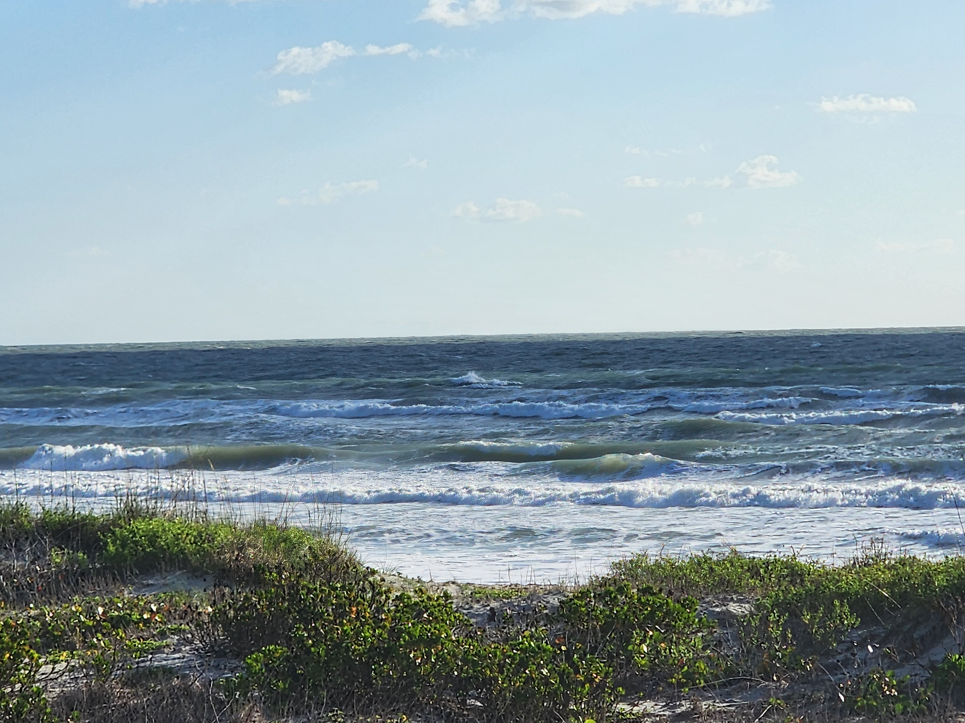 Cocoa Beach surf photo 2 — 1-2' with light winds — fun morning longboard session.