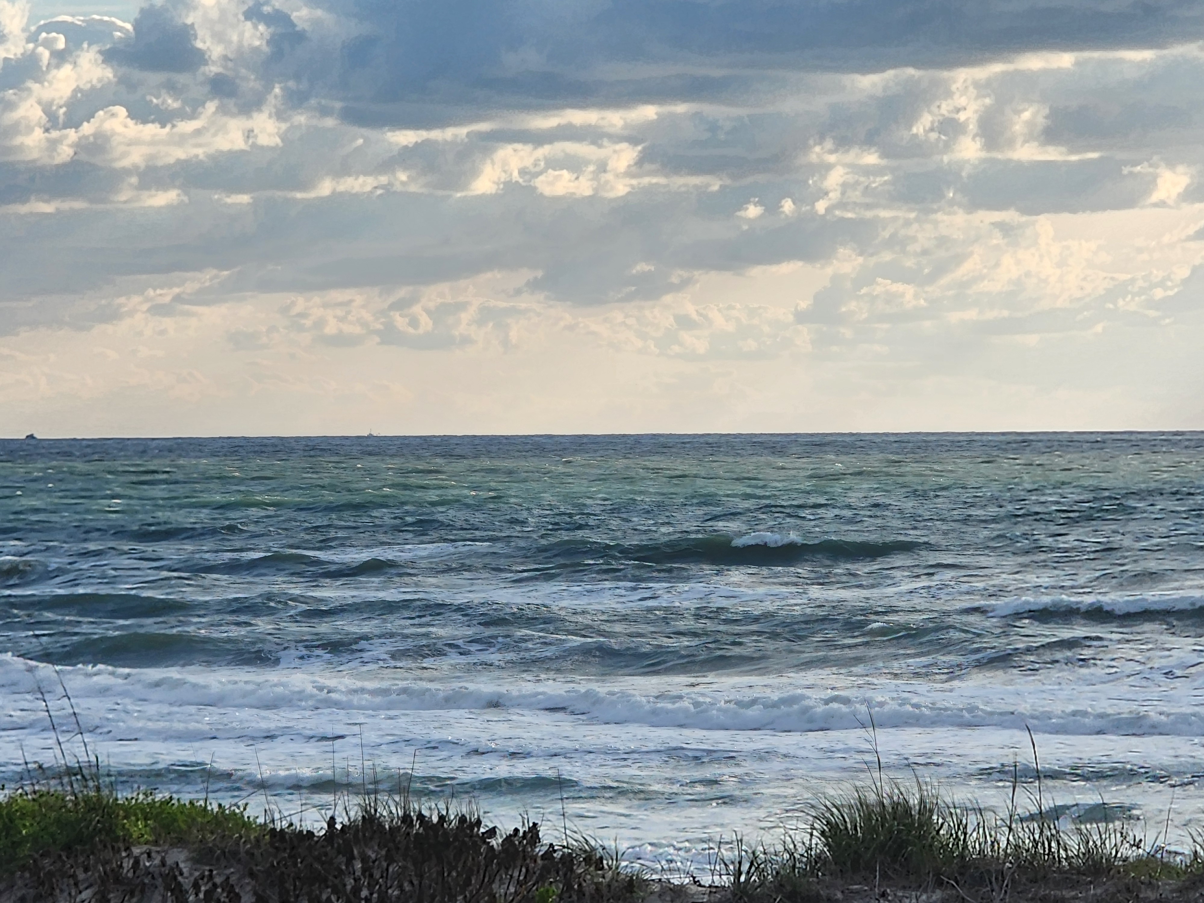 Cocoa Beach surf photo 2 — 1-2' with light ESE texture — rideable but bumpy.