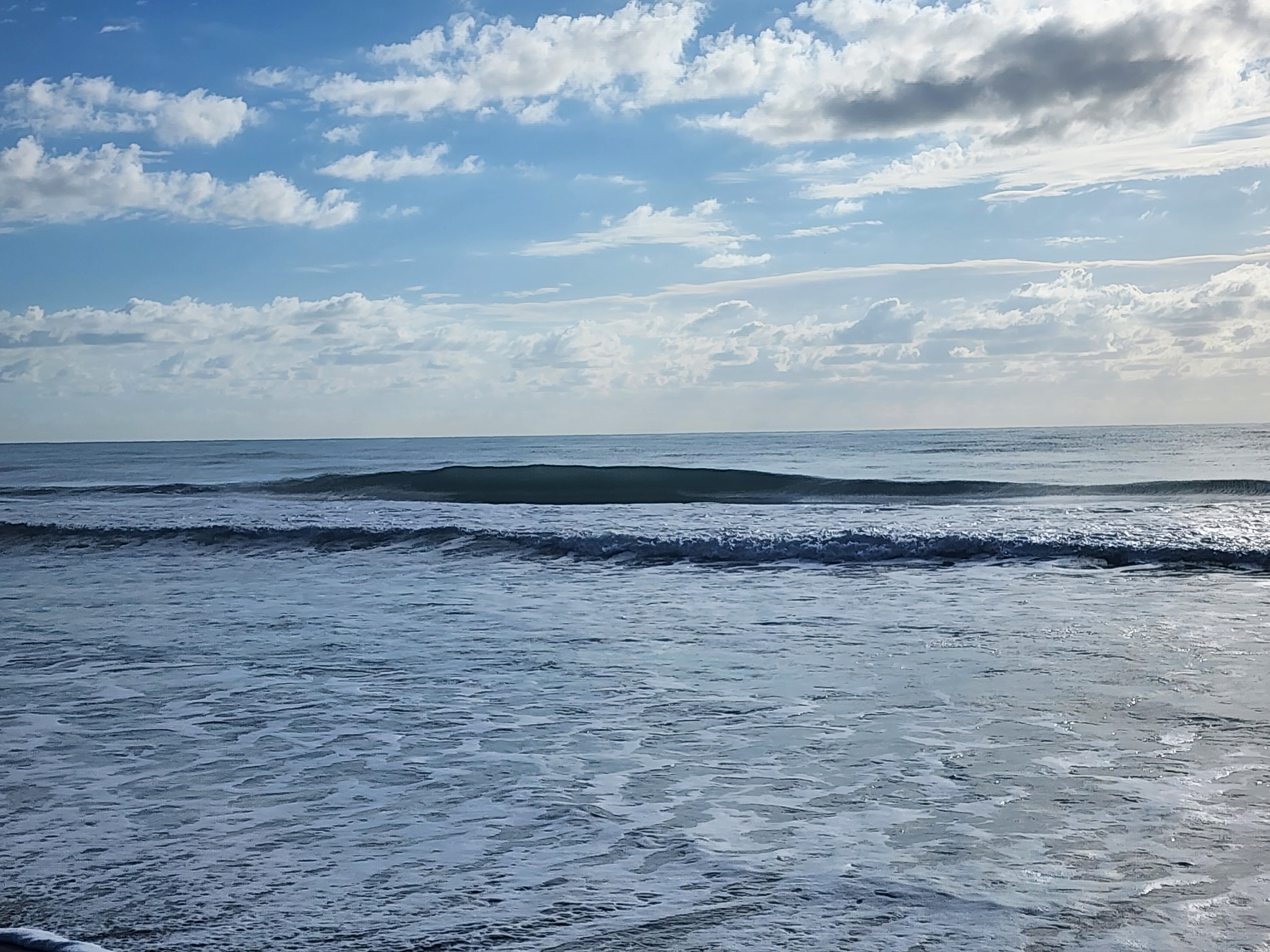 Morning session conditions with clean small waves at Picnic Tables South Cocoa Beach