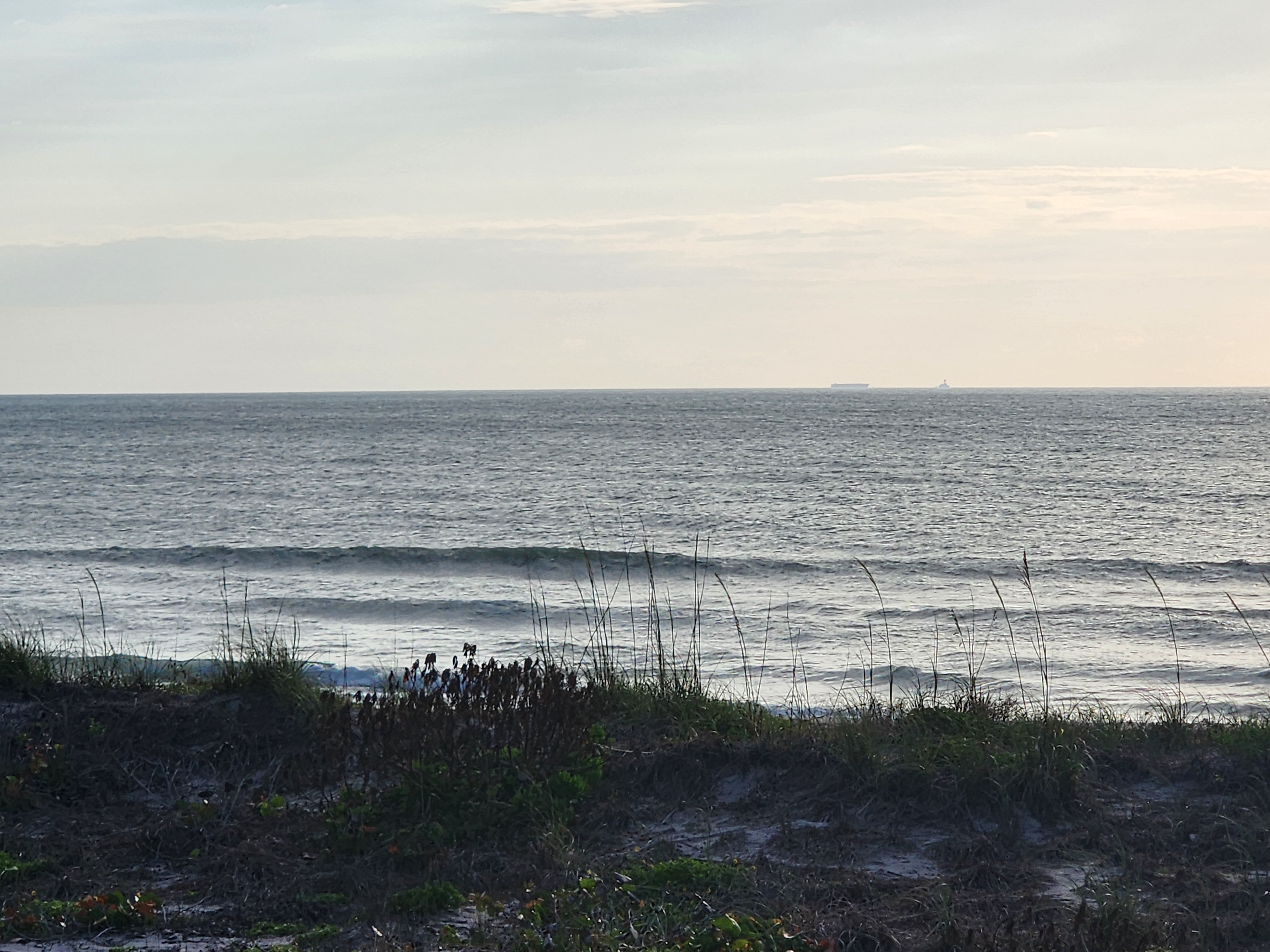 Small wave breaking nearshore with SSW wind texture at 31st Street Cocoa Beach