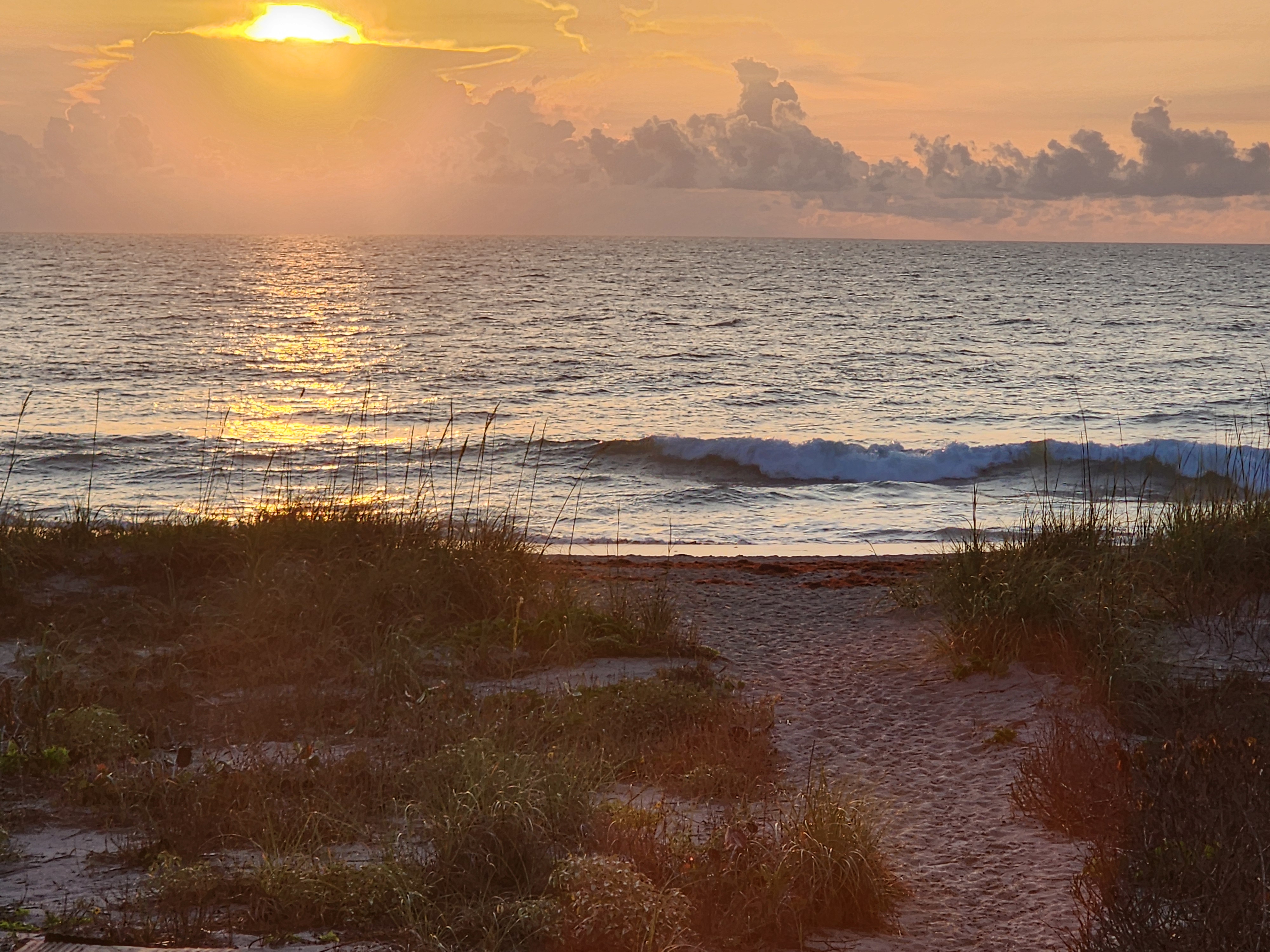 Nearly flat ocean with tiny shore break at 31st Street Cocoa Beach high tide morning