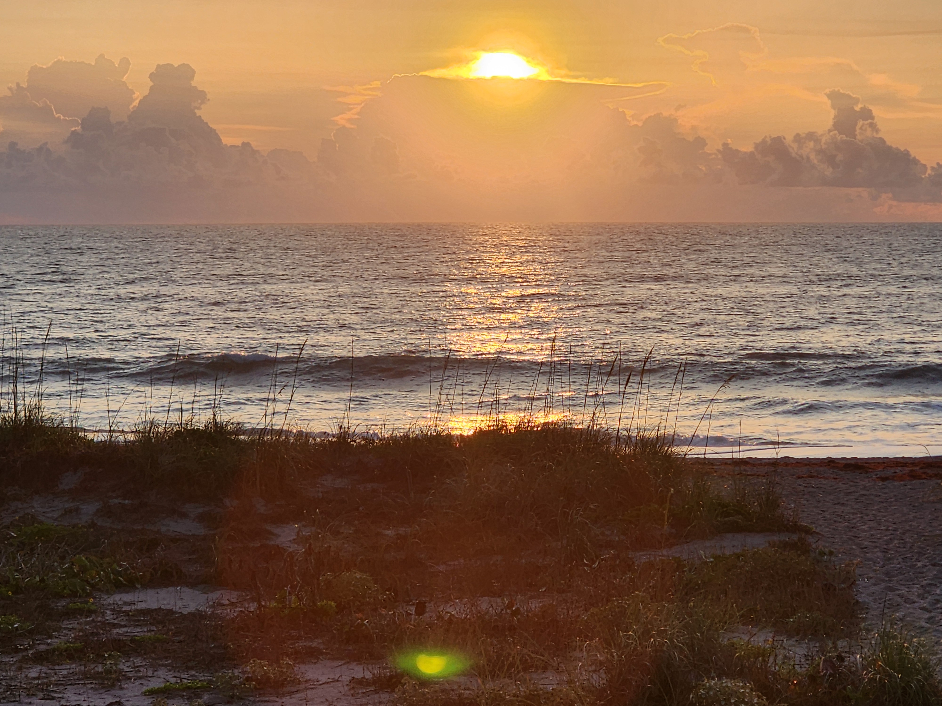 Morning light on flat calm surf at Picnic Tables South Cocoa Beach skimboard conditions April 27