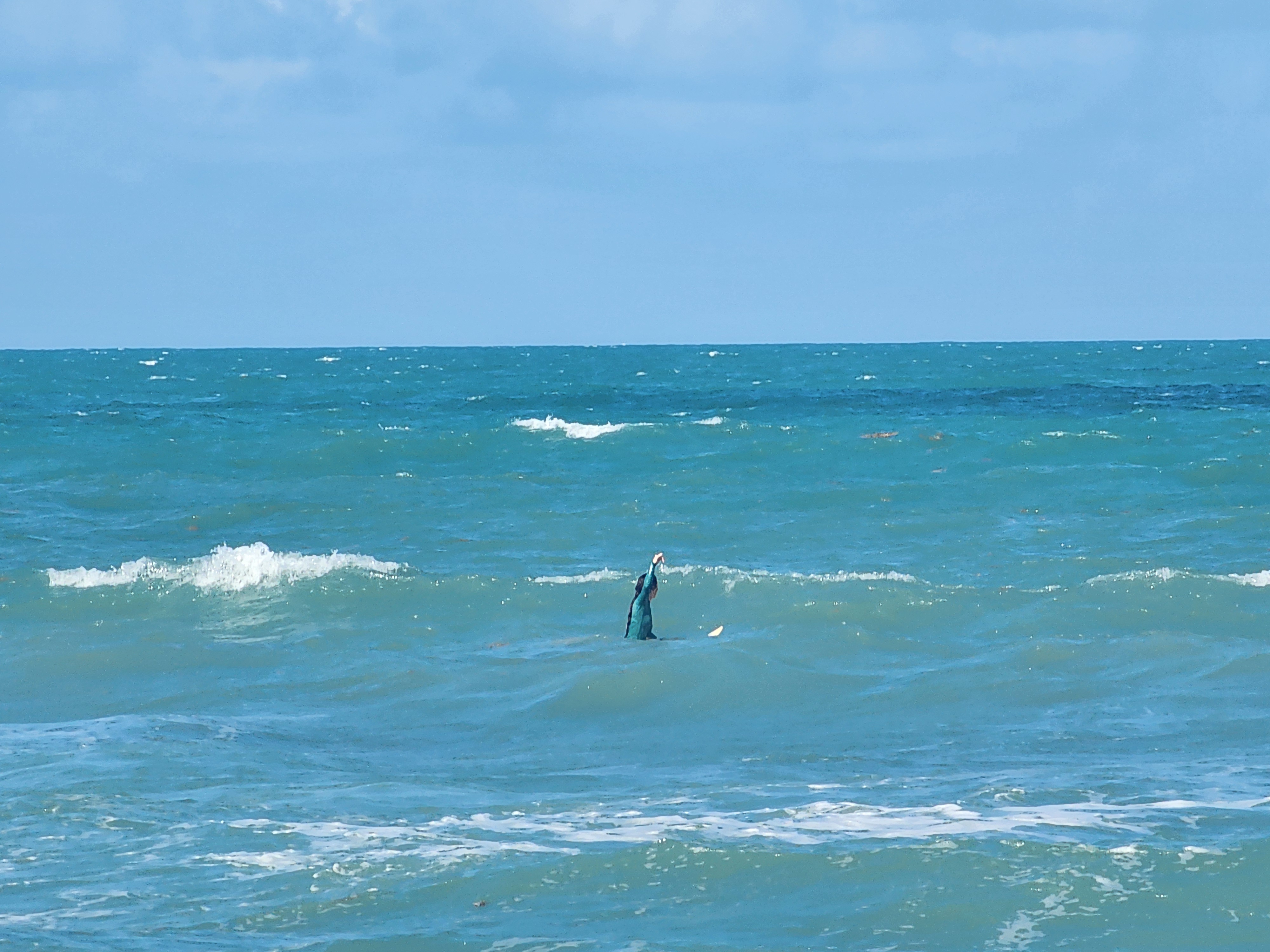Golden sunset light on clean small waves at 31st Street Cocoa Beach afternoon session