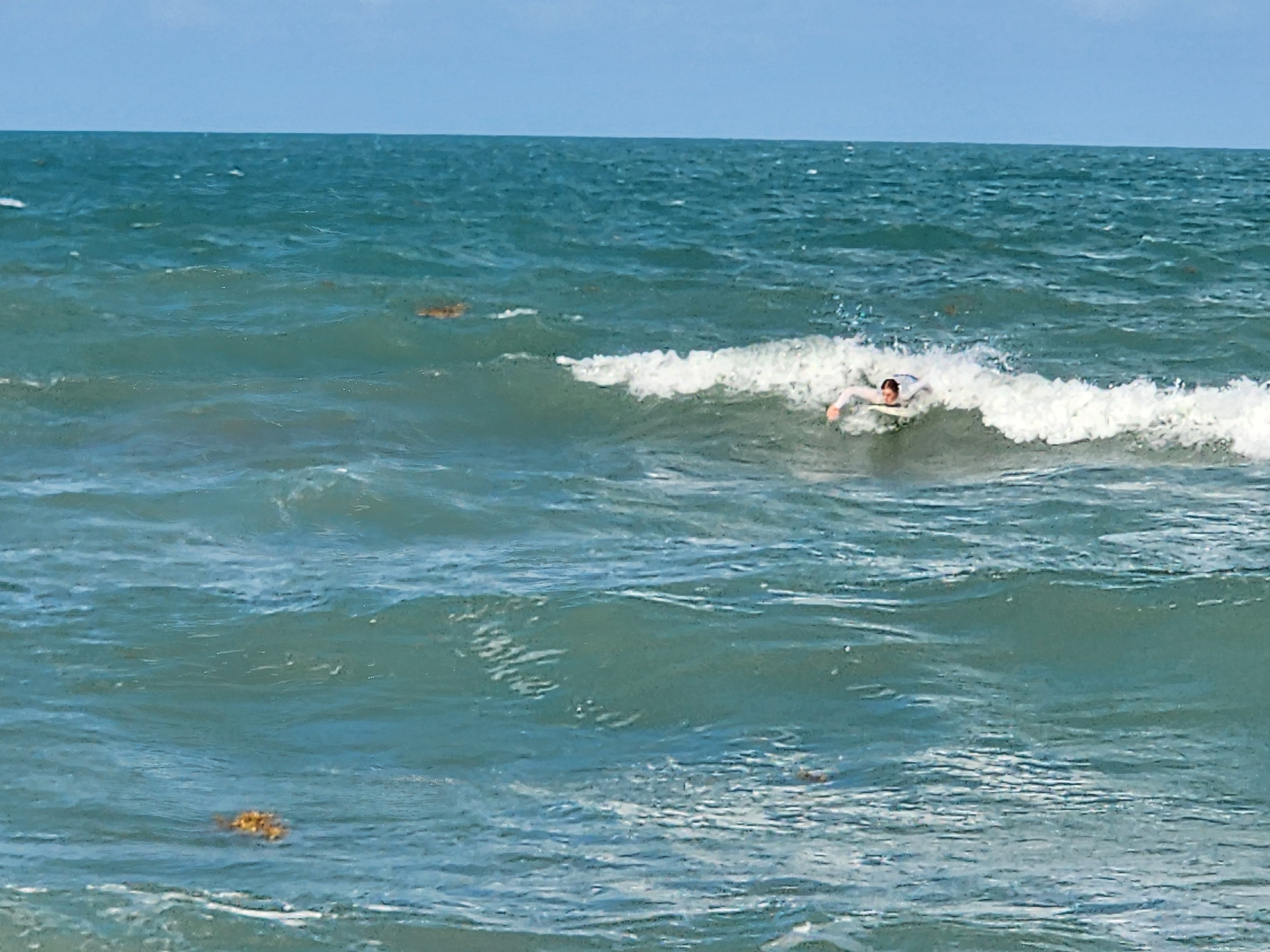 Clean small wave breaking in golden light at Picnic Tables South Cocoa Beach afternoon glass-off