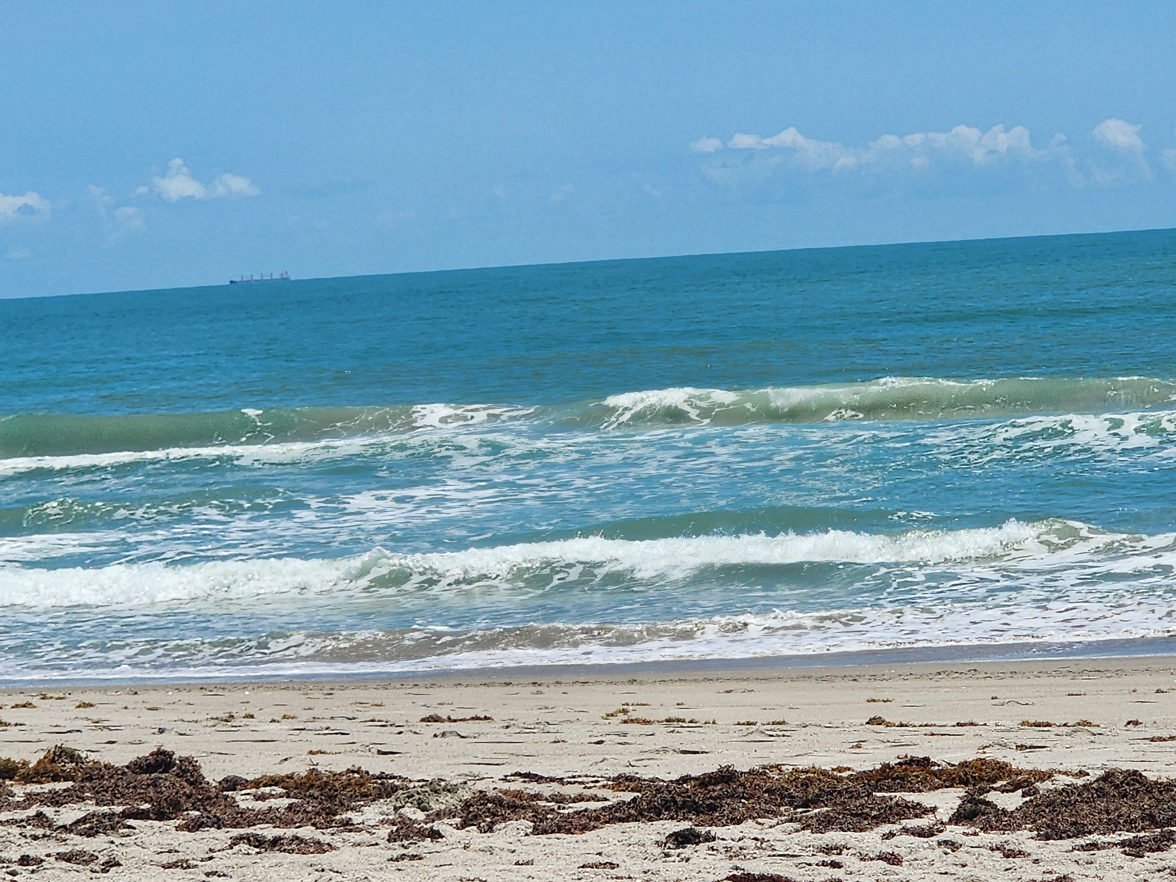 Afternoon glass with 1-2 foot surf and SSW winds at Picnic Tables South Cocoa Beach