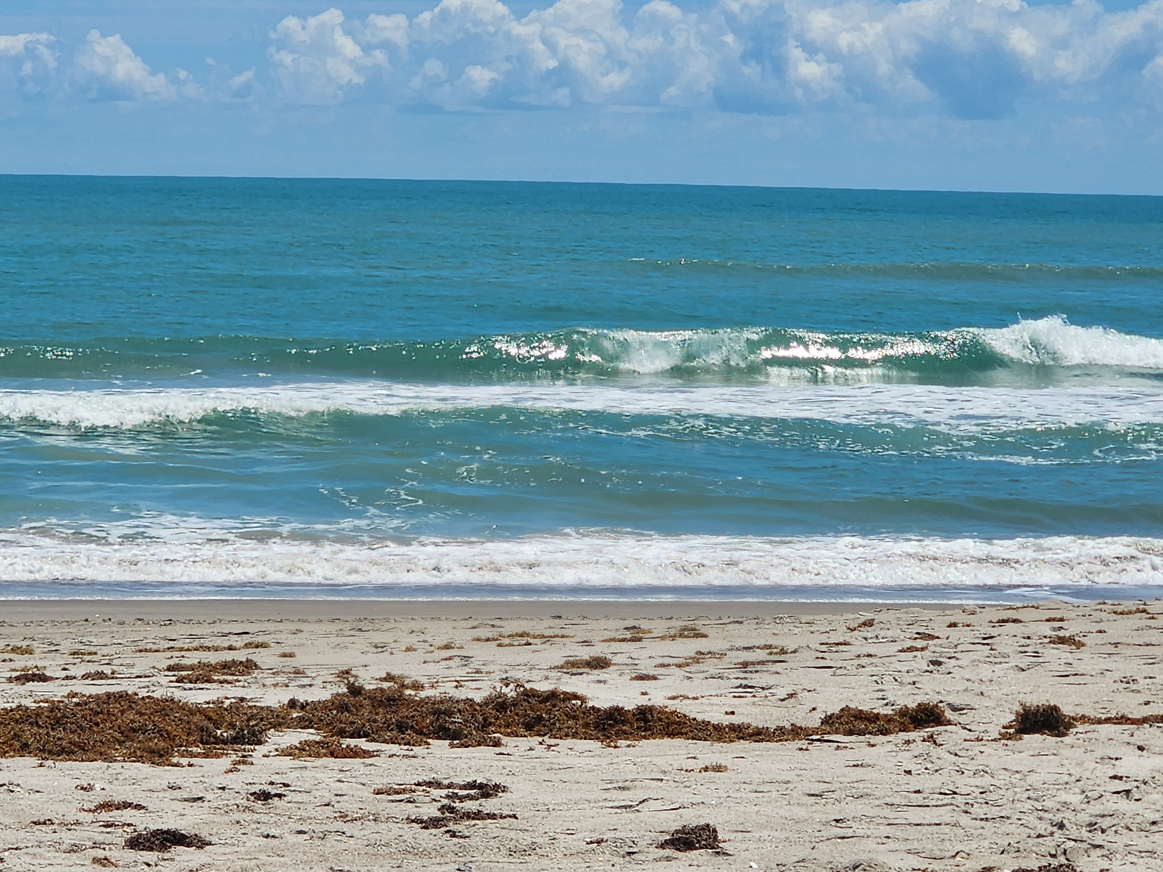 Cocoa Beach surf photo 6 — Cocoa Beach 2'+ clean lines but sandbars are shot. Longboard lines falling into troughs.