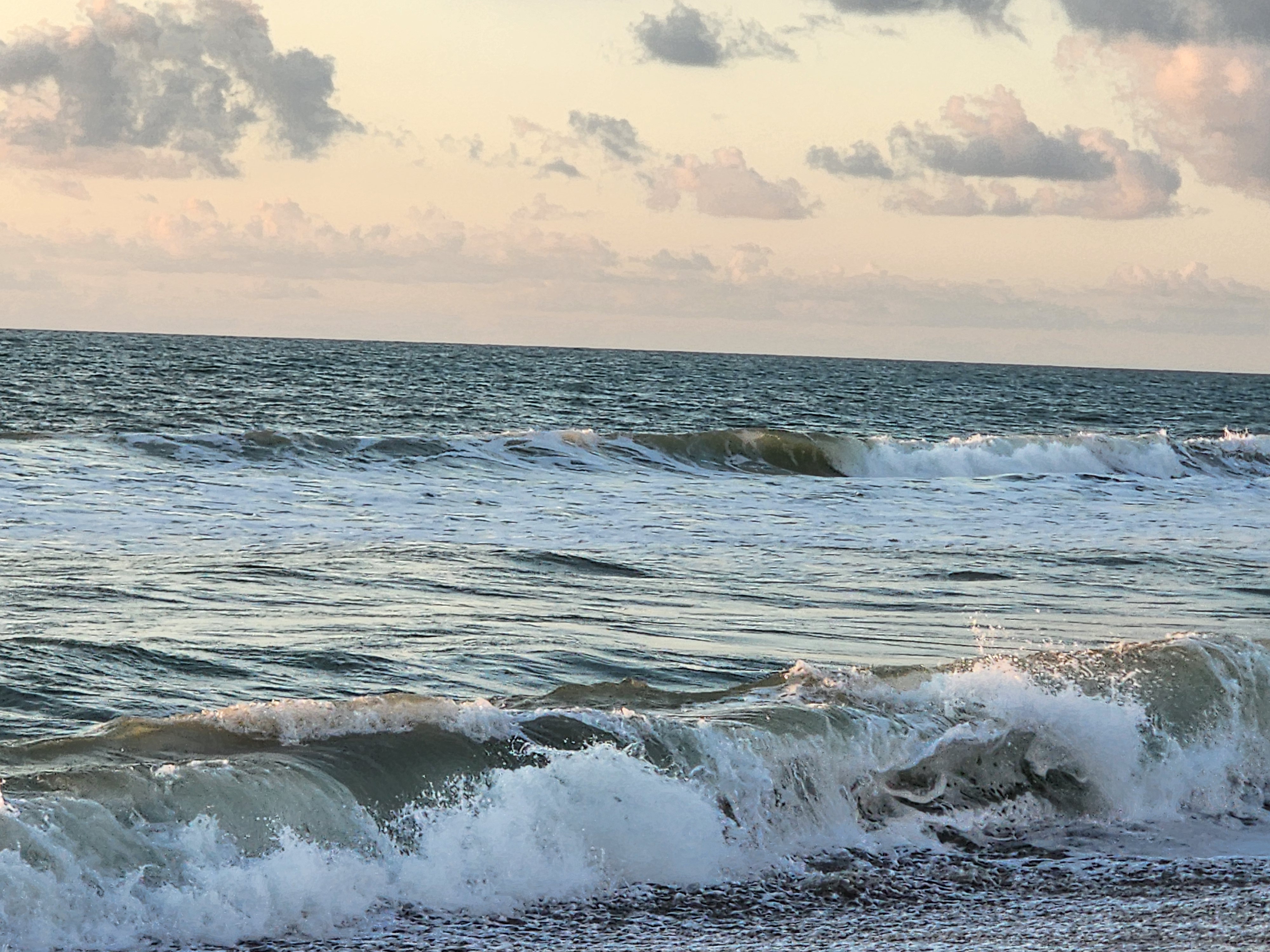 Morning light on clean small surf at 31st Street Cocoa Beach sea oats in foreground