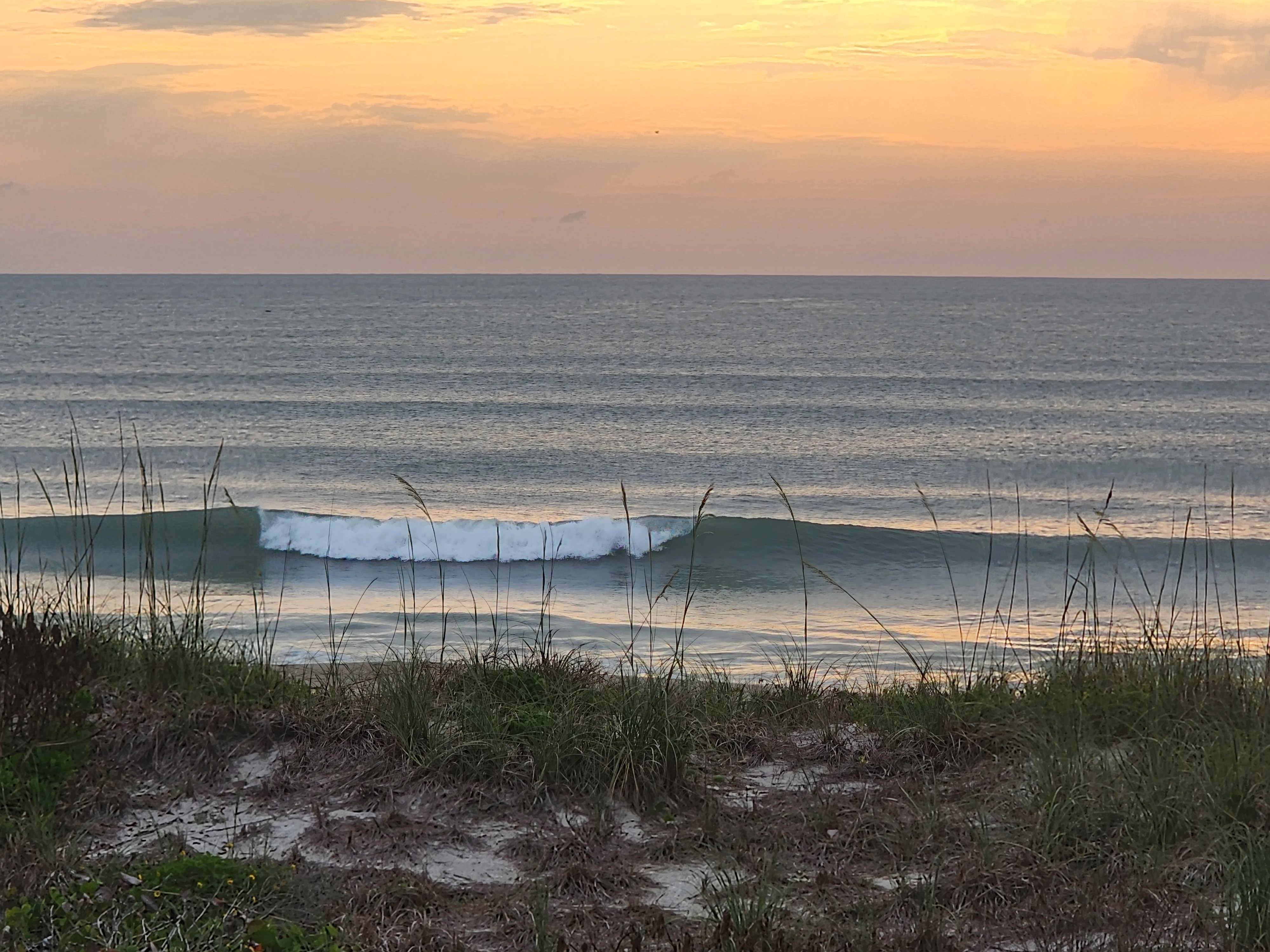 Glassy 2 foot wave with long clean lines from swell at Picnic Tables South Cocoa Beach May 1 2026