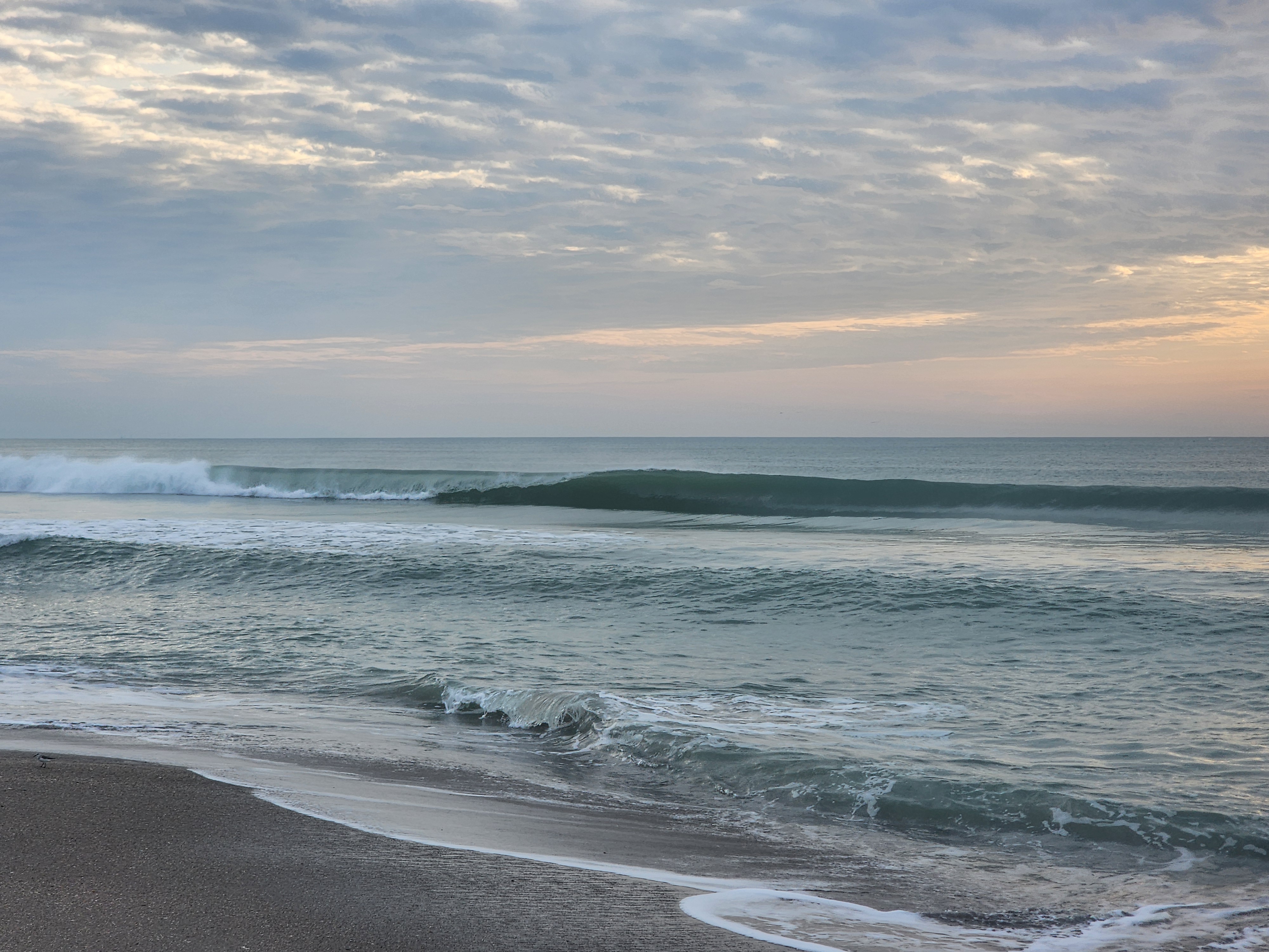 Multiple clean lines stacking up at Picnic Tables South Cocoa Beach high tide offshore winds May 1 2026