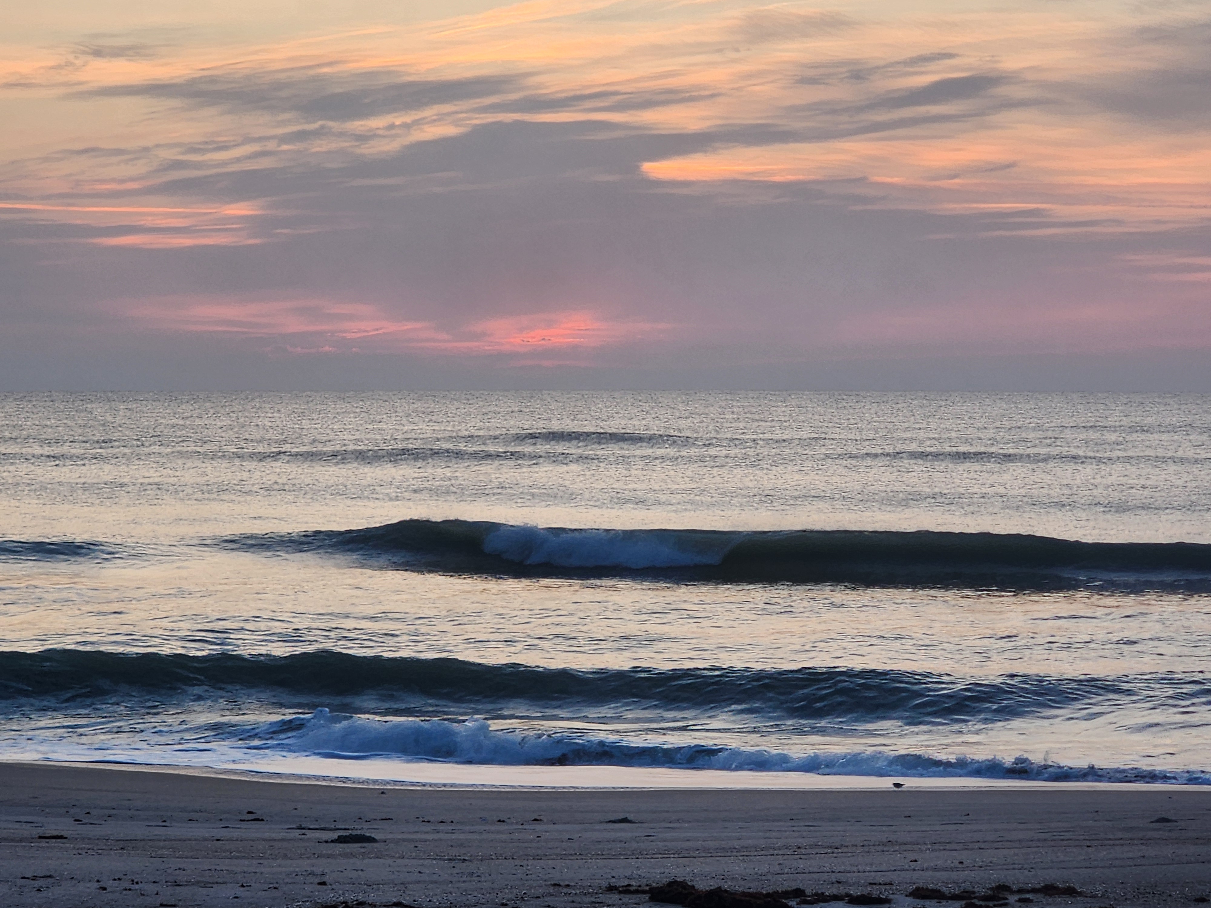 Morning light on glassy 2 foot surf at Picnic Tables South Cocoa Beach third consecutive clean day