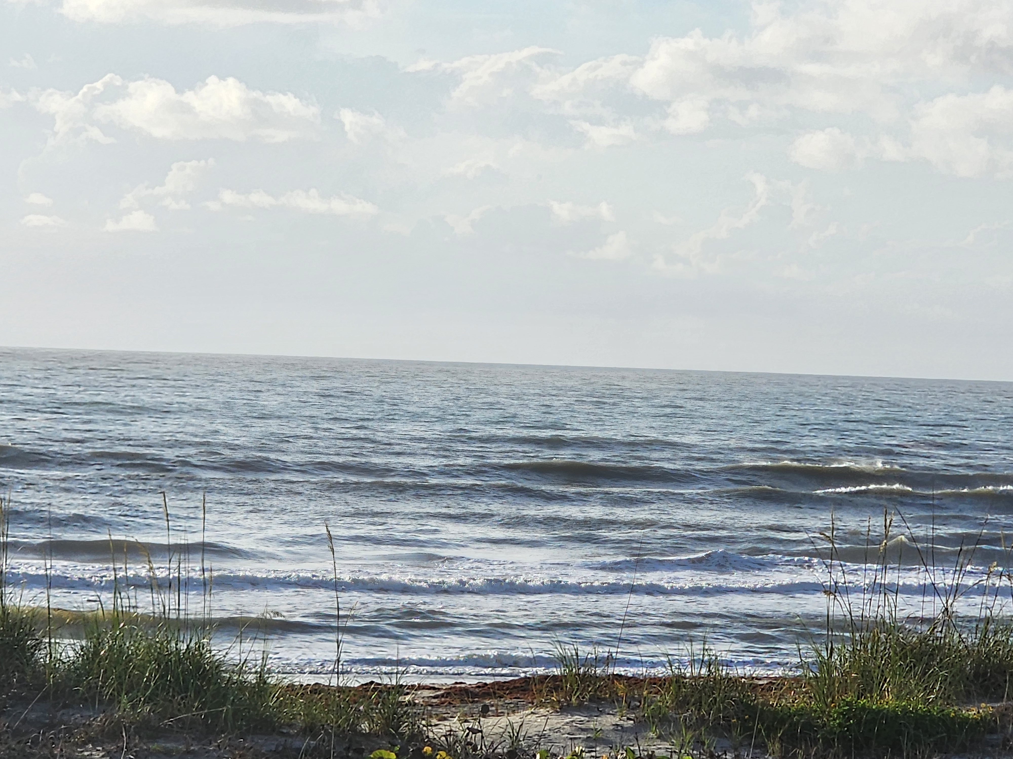 Cocoa Beach surf photo 3 — 2-3'+ with light onshore 5 mph or less — fairly clean and fun for shortboard or longboard. Hot day, get out there!