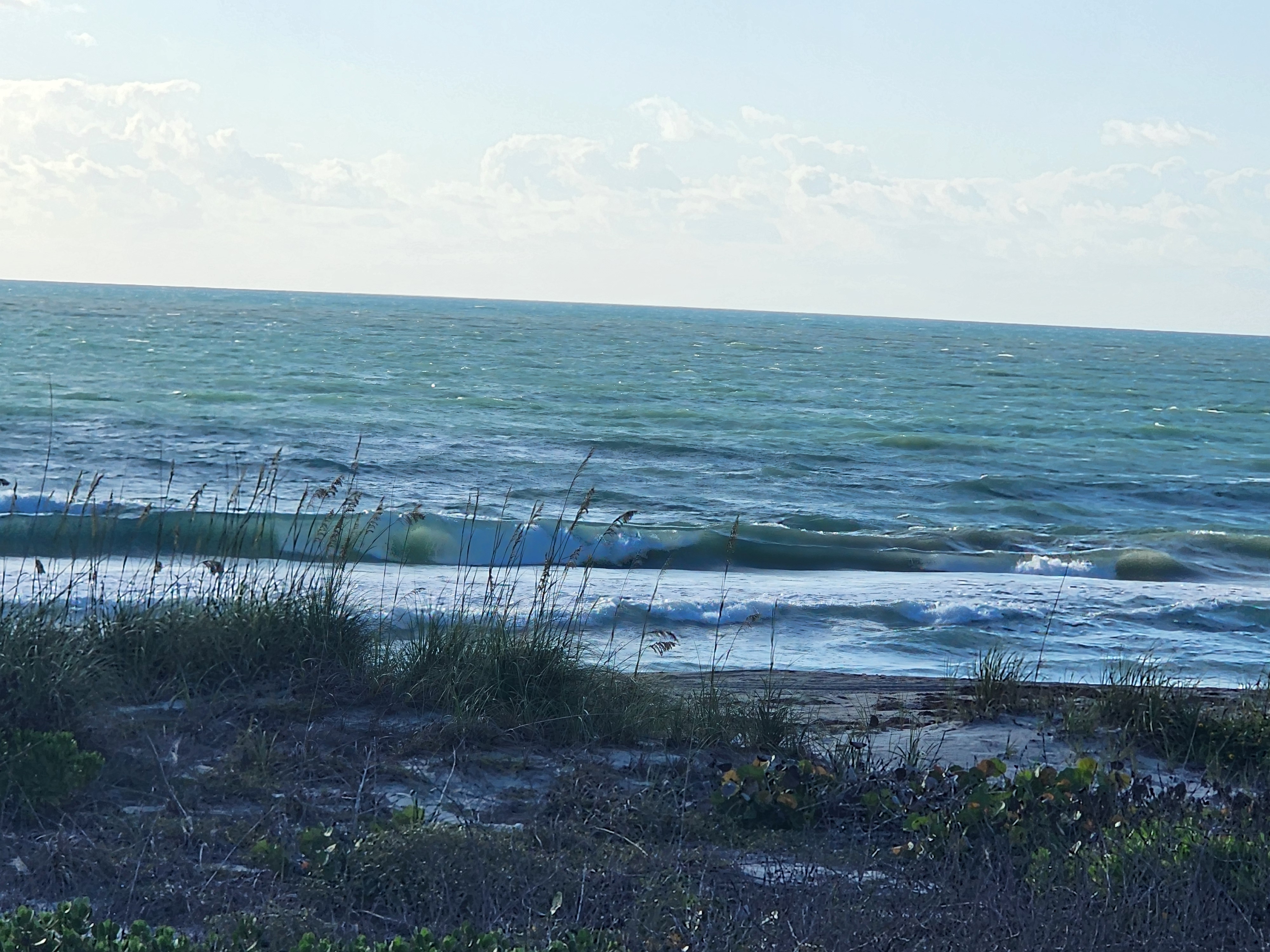 Cocoa Beach surf photo 3 — 8:10 AM lowtide — 2-3' onshore chop, longboard or short finds a bump