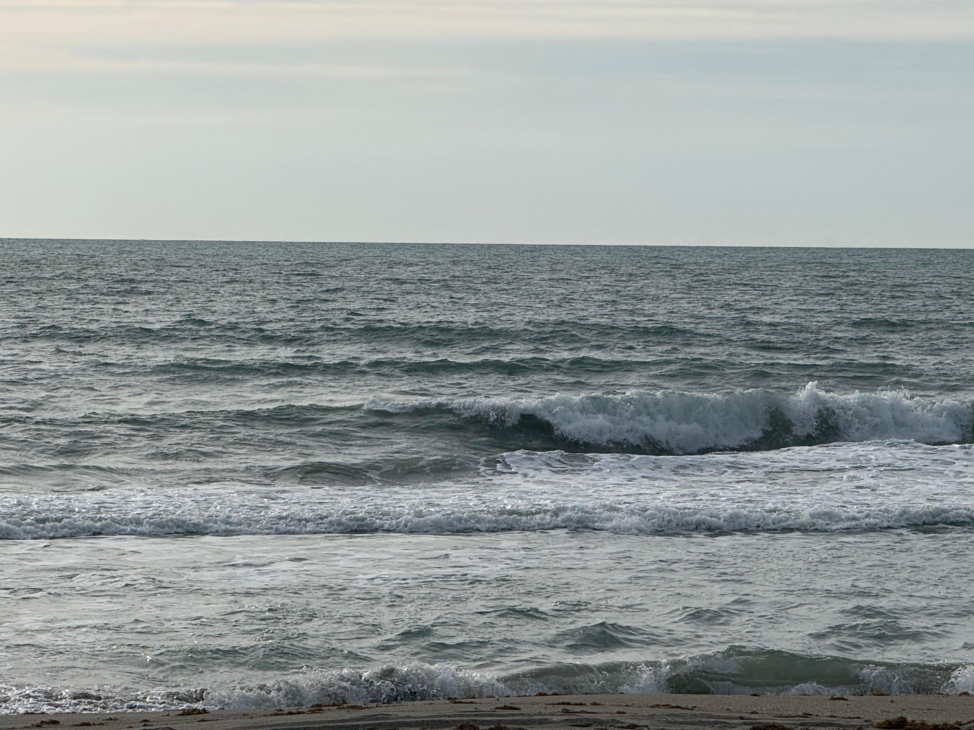 Cocoa Beach surf photo 4 — 8 AM lowtide — 2' onshore chop, swell on the buoys, beautiful day to get out there!