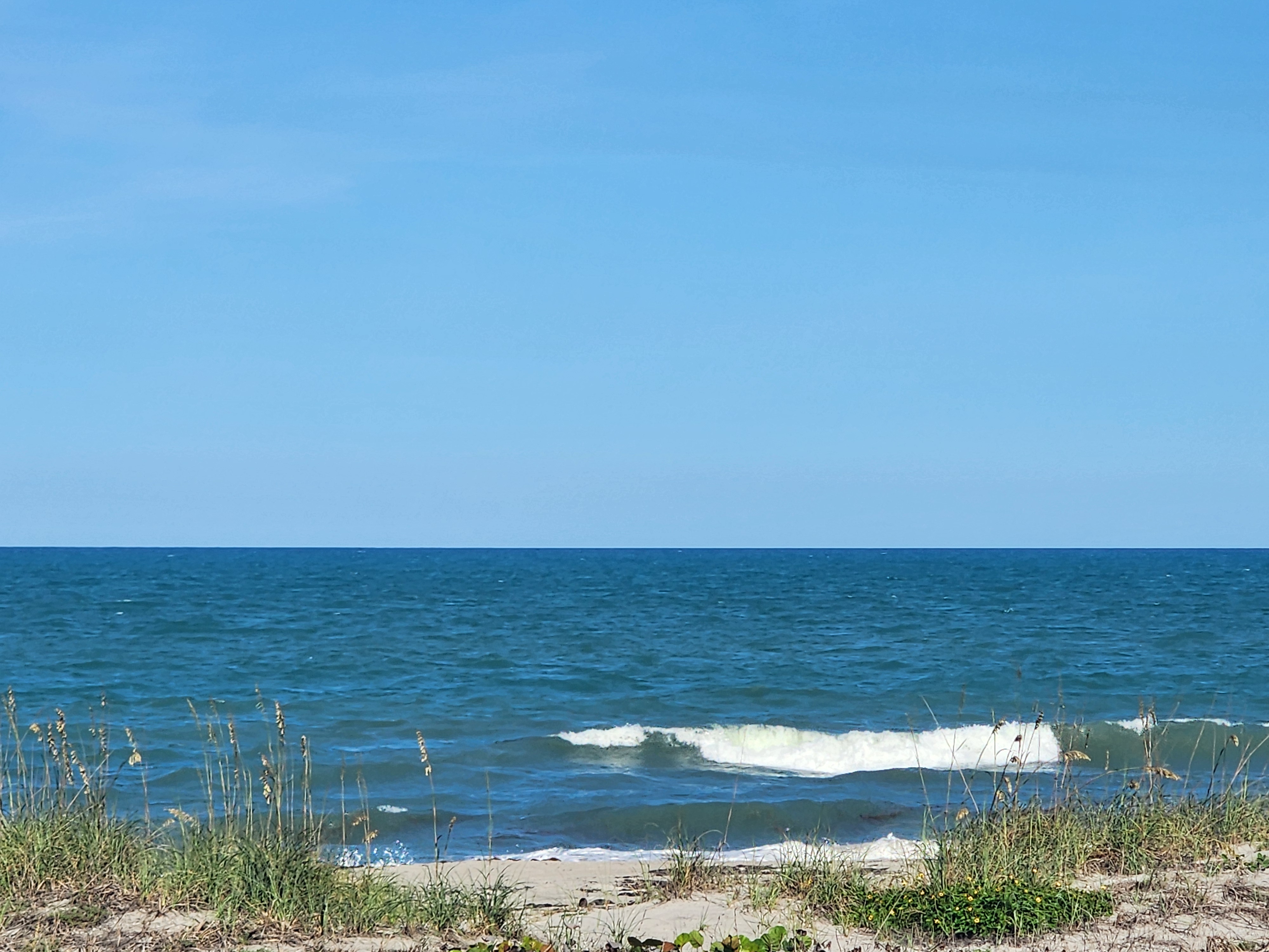 Cocoa Beach surf photo 1 — 5:45 PM hightide — 1-2' ESE bump, longboard or grom wave. Welcome to the doldrums.